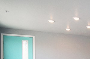 Pet-Friendly Apartments in Reno, NV - Dining Room with Kitchen Bar, Overhead Lighting, and Front Door